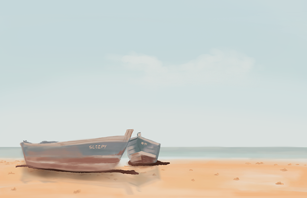 Two small rowing boats rest on the beach.